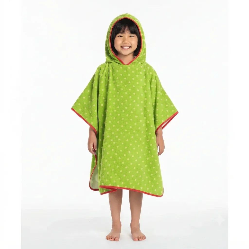 Child wearing a green dotted hooded towel poncho.