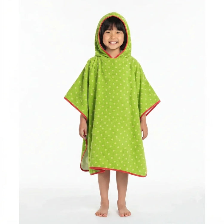 Child wearing a green dotted hooded towel poncho.