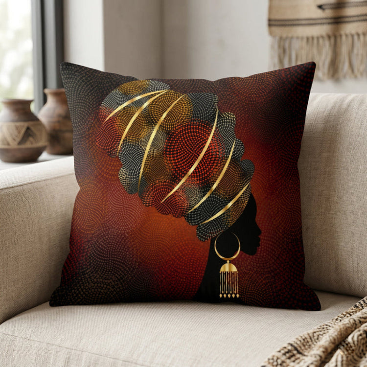Dark rust cushion cover with a black profile silhouette and a striped gold coloured headwrap.