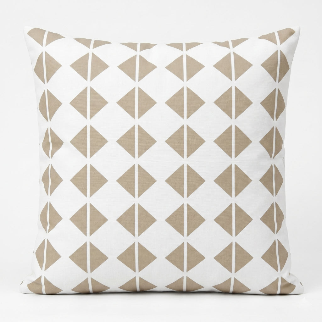White cushion cover with rows of small beige geometric diamonds.