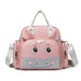 Pink zippered bag with a cartoon animal face, gray handles and shoulder strap