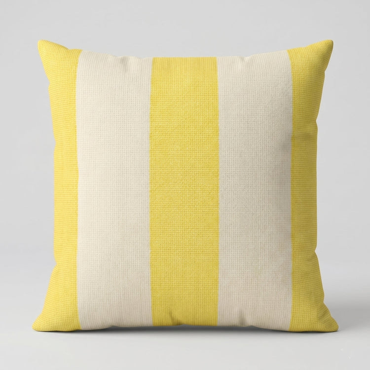 Cushion cover with broad pale yellow and cream vertical stripes.