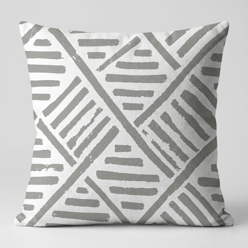 White cushion cover with grey geometric diagonal line patterns.