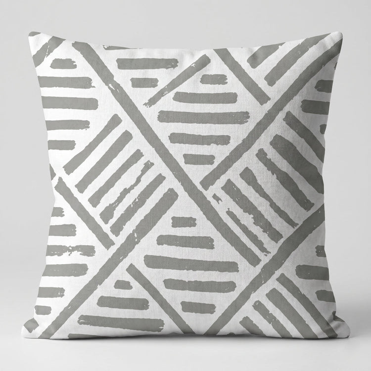 White cushion cover with grey geometric diagonal line patterns.
