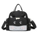 Black zippered bag with a cartoon animal face, carry handles and shoulder strap