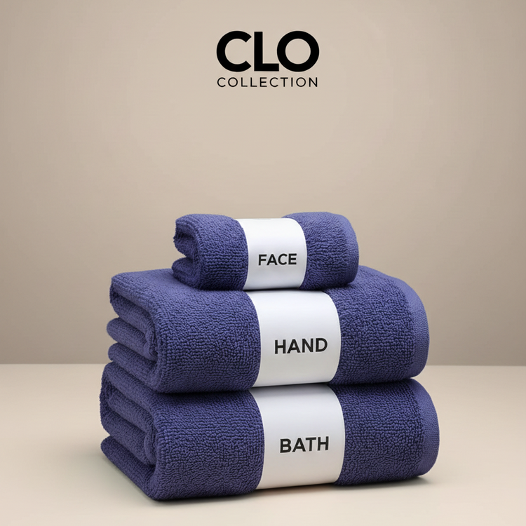 Navy face, hand and bath towels stacked with labelled paper bands.