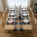 Dark multicoloured geometric table runner with matching placemats.