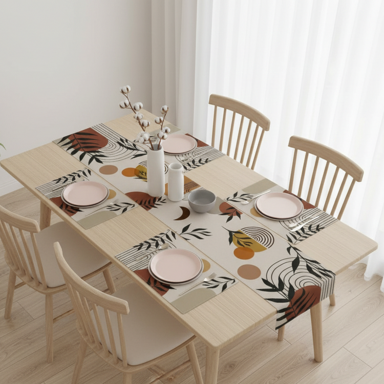 Cream table runner with brown and black botanical silhouettes and matching placemats.
