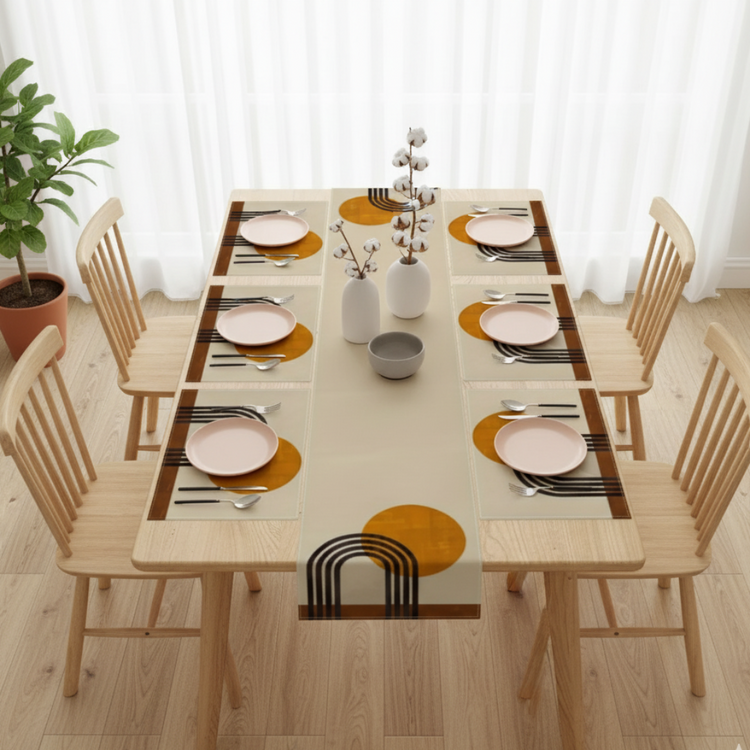 Cream table runner with mustard circles, black arches and matching placemats.