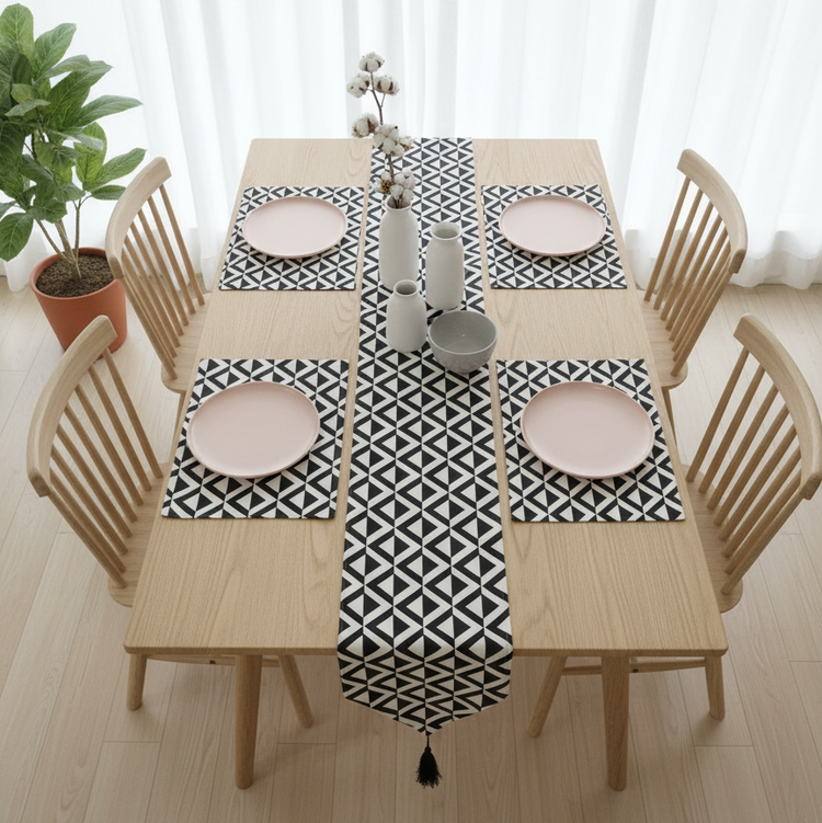 Black and white small-triangle mosaic table runner with matching placemats.