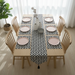 Black and white small-triangle mosaic table runner with matching placemats.