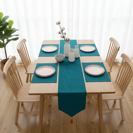 Plain teal velvet table runner with matching teal placemats.