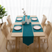 Plain teal velvet table runner with matching teal placemats.