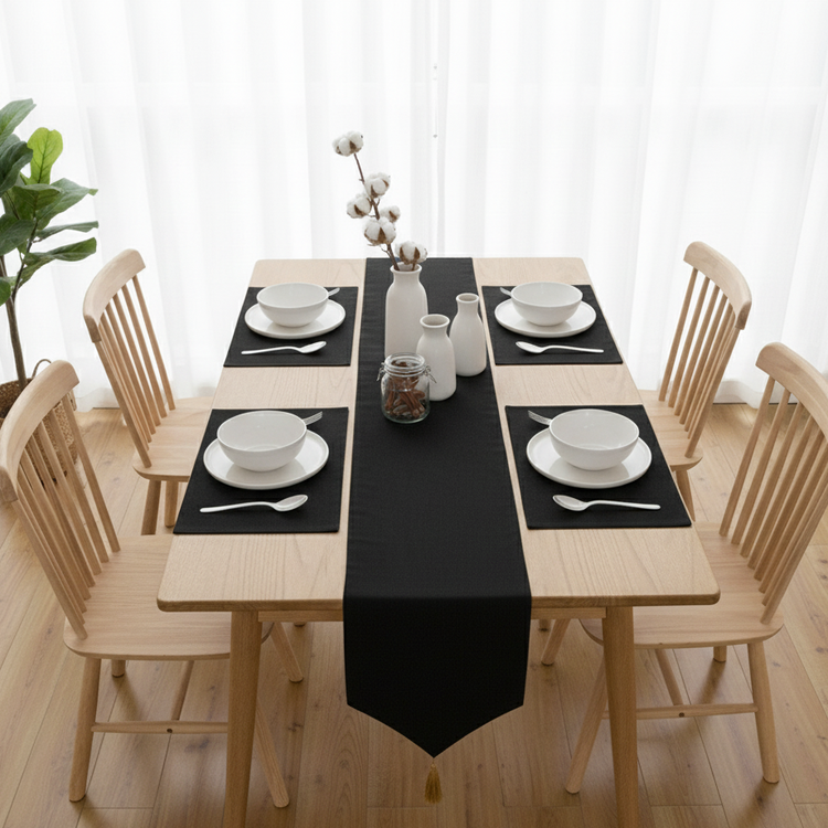 Plain black velvet table runner with matching black placemats.