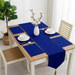 Royal blue velvet table runner with matching blue placemats.
