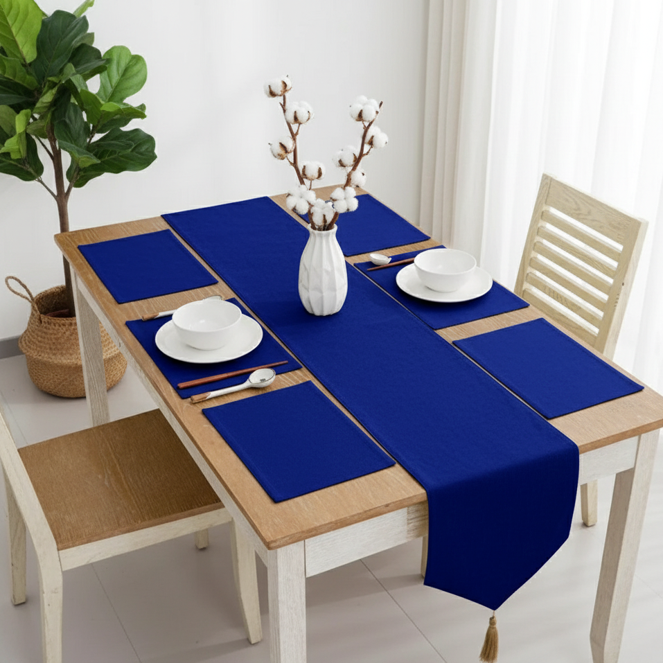 Royal blue velvet table runner with matching blue placemats.