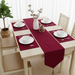Maroon velvet table runner with matching maroon placemats.