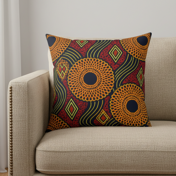 Colourful circular geometric cushion cover displayed on a cream armchair.
