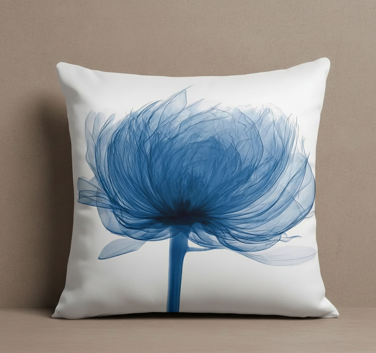 White cushion cover with a large soft blue flower.