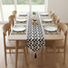 Black and white zigzag table runner with matching placemats.