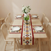 Colourful geometric table runner with red borders and matching placemats on a dining table.