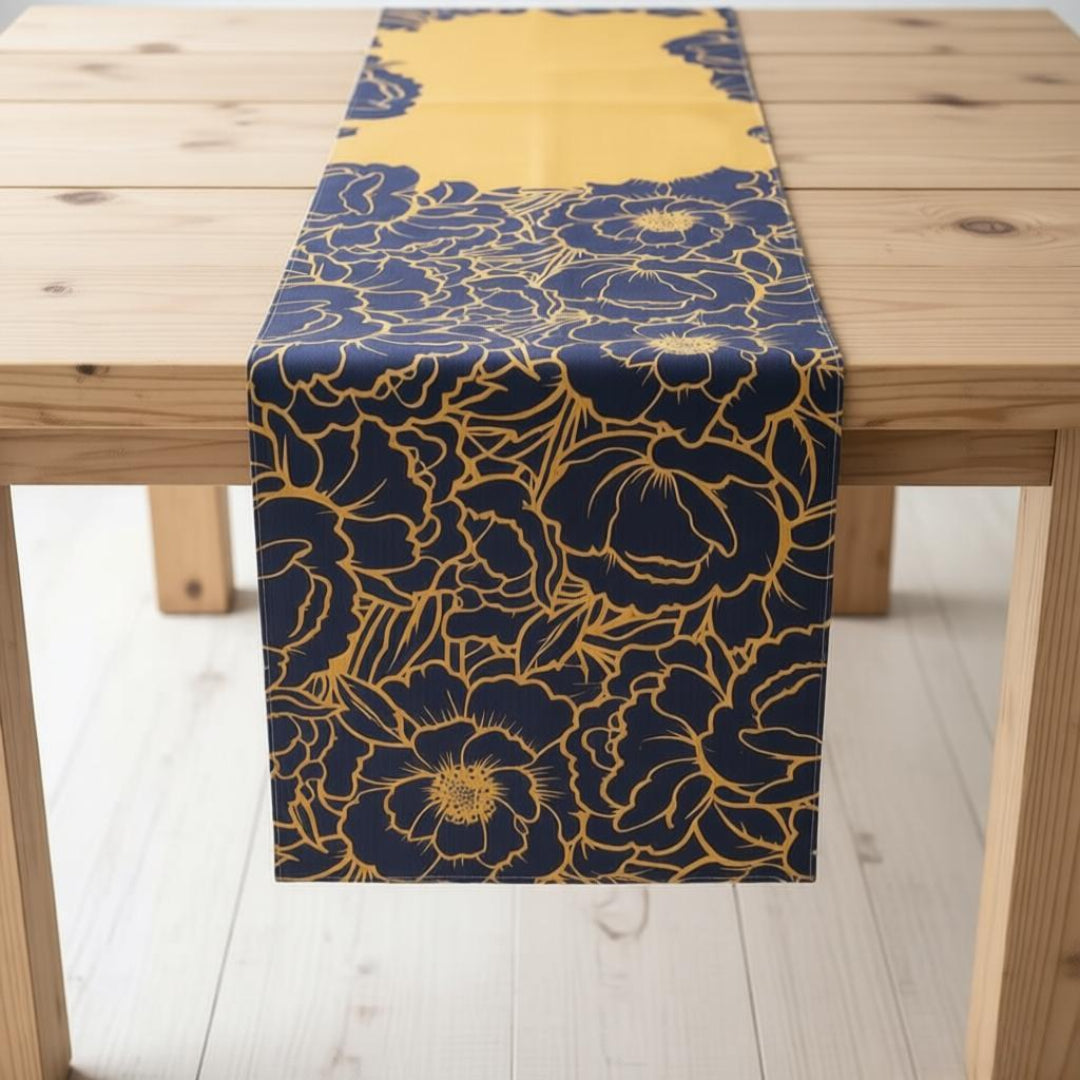 Navy table runner with gold-coloured floral outlines and a mustard panel.