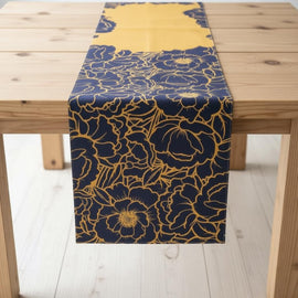 Navy table runner with gold-coloured floral outlines and a mustard panel.