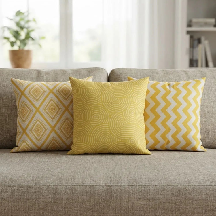 Golden Rhythm Cushion Covers pack of 3 placed on a sofa 
