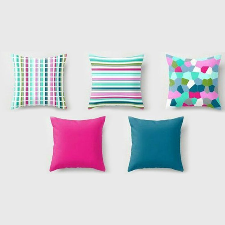 Five cushion covers with colourful stripes and abstract shapes plus plain pink and teal designs.