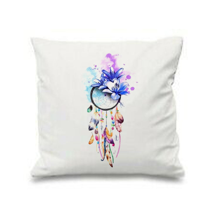 White cushion cover with a colourful dreamcatcher and hanging feathers.