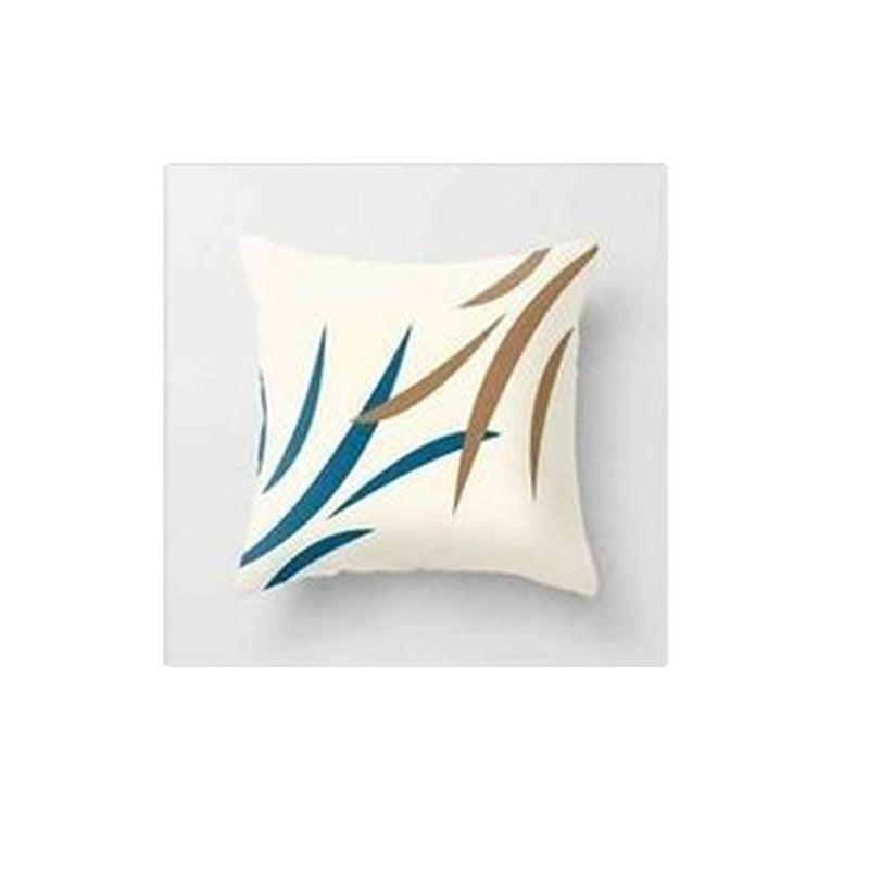 Cream cushion cover with slender blue and tan leaves.