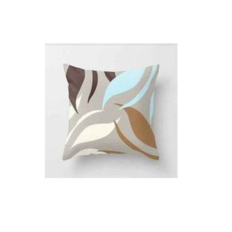 Cream cushion cover with large curved grey, tan and pale blue leaf shapes.