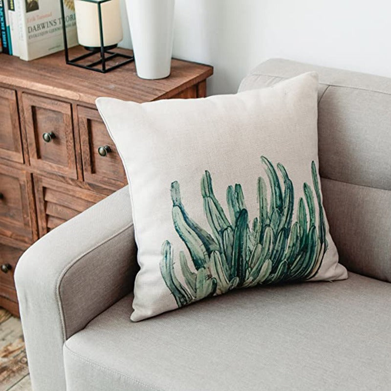 Cream cushion cover with a cluster of upright green cacti.