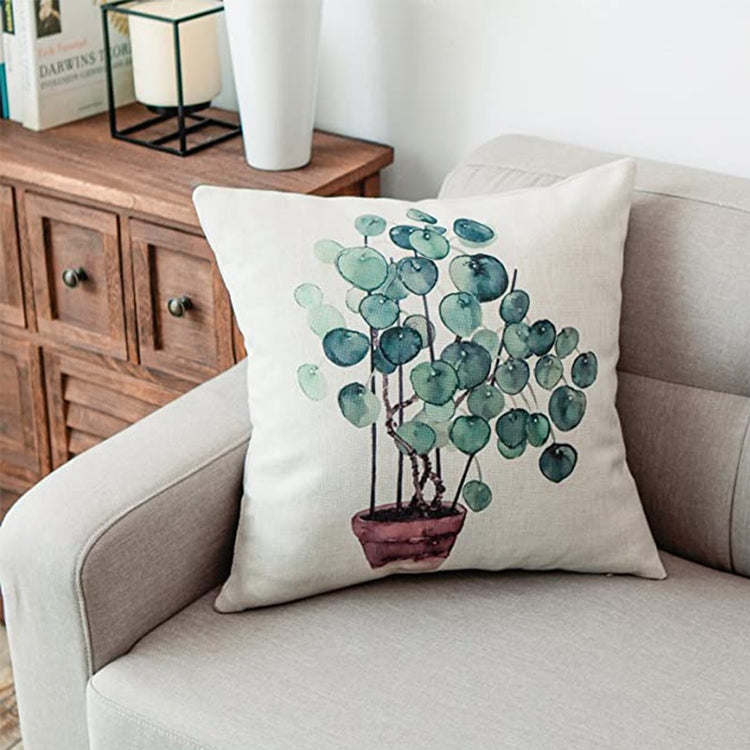 Cream cushion cover with a potted plant with round green leaves.