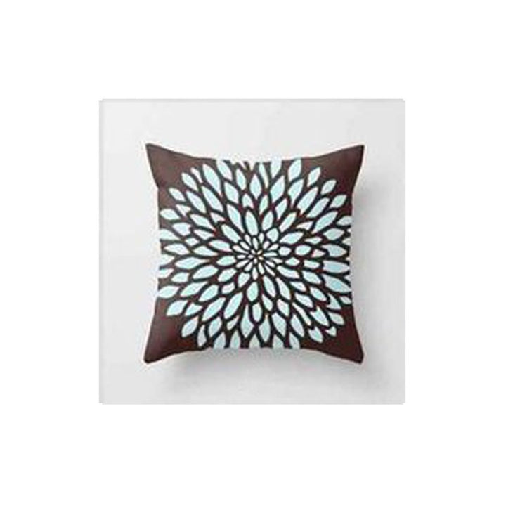 Brown cushion cover with a large pale blue radial flower pattern.