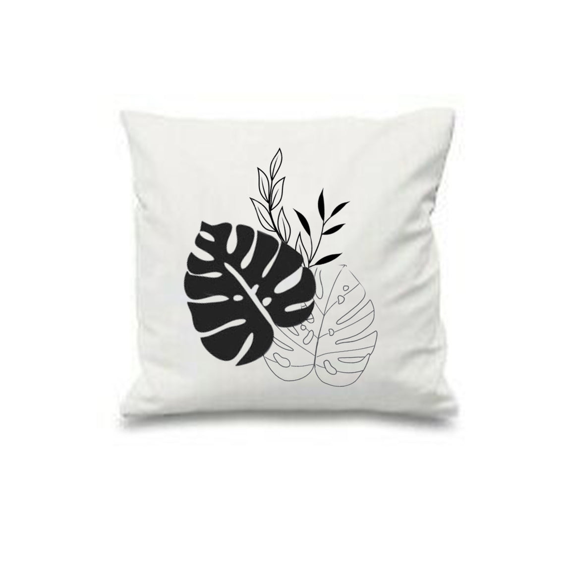 White cushion cover with a black monstera leaf and fine leaf outlines.