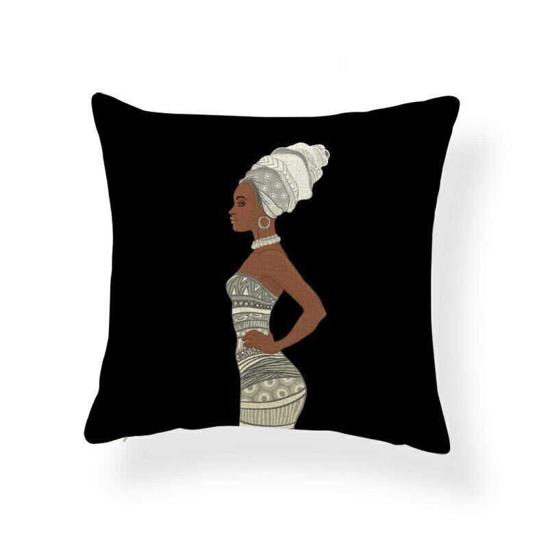 Black cushion cover with a woman wearing a pale headwrap and patterned dress.