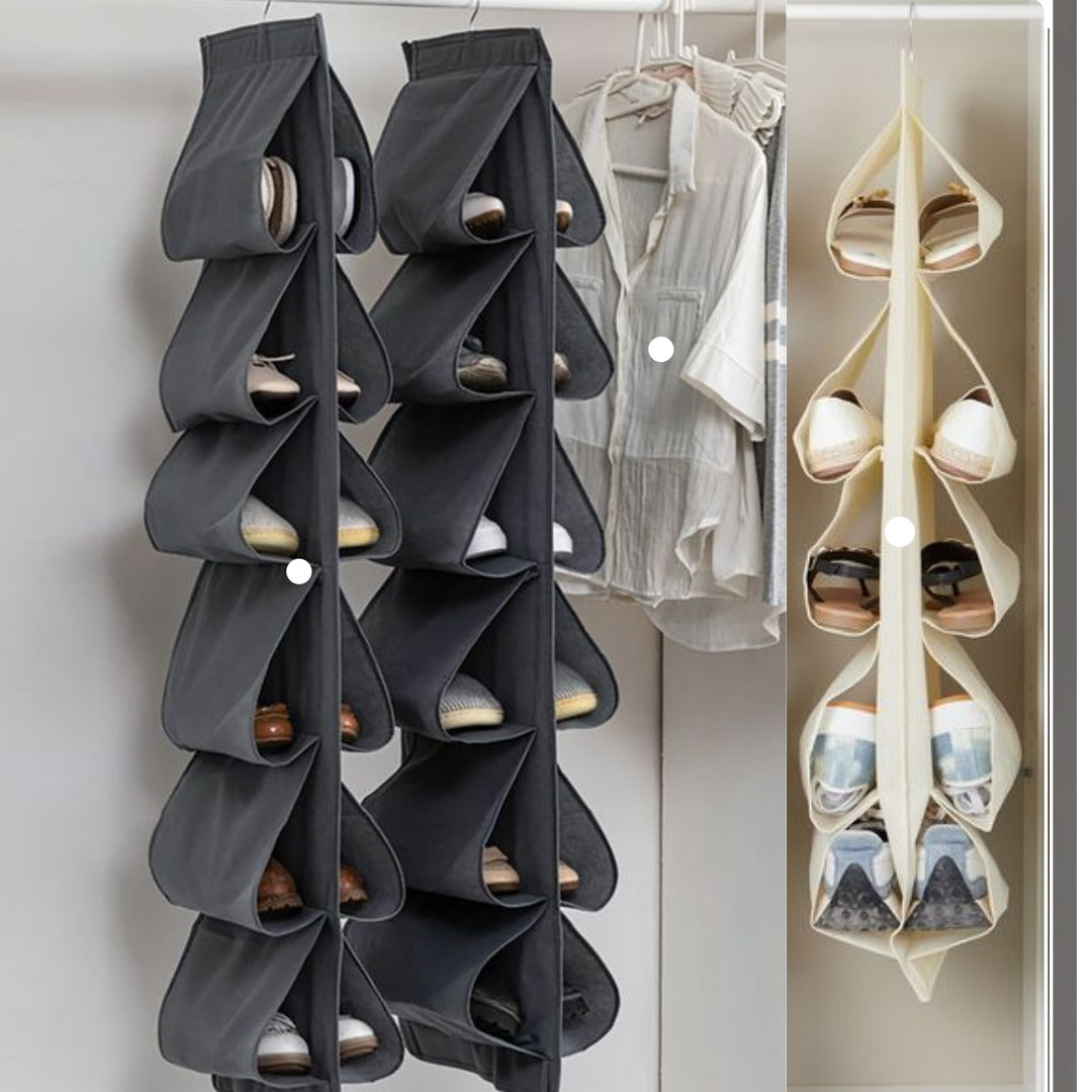 Grey and cream hanging shoe organizers holding shoes in a wardrobe.