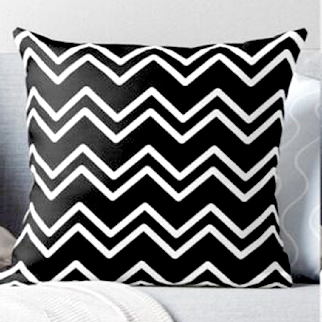 Black cushion cover with white zigzag stripes.