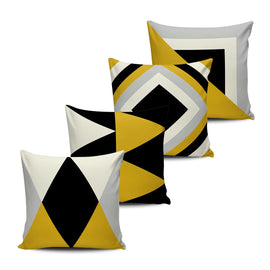 Four mustard, black, grey and cream cushion covers with bold geometric shapes.