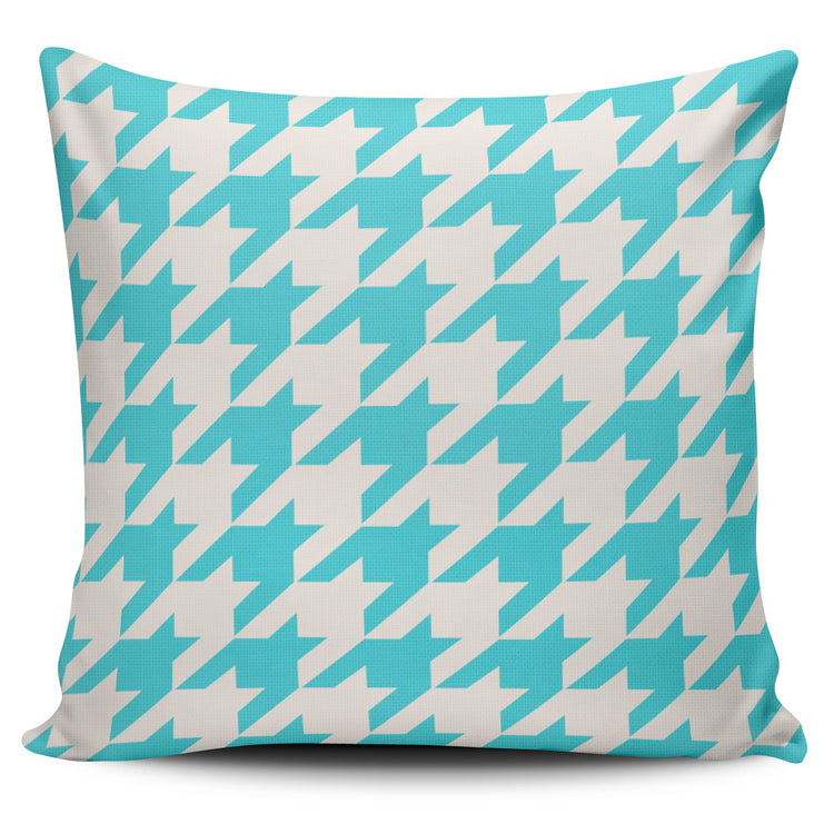 Cushion cover with a turquoise and cream houndstooth pattern.
