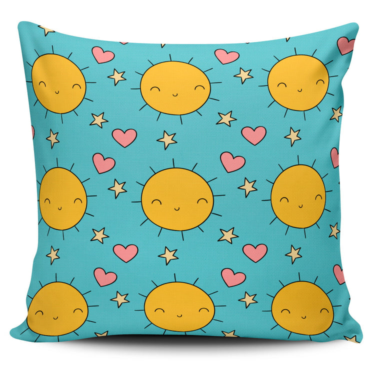 Turquoise cushion cover with yellow suns and small pink hearts.