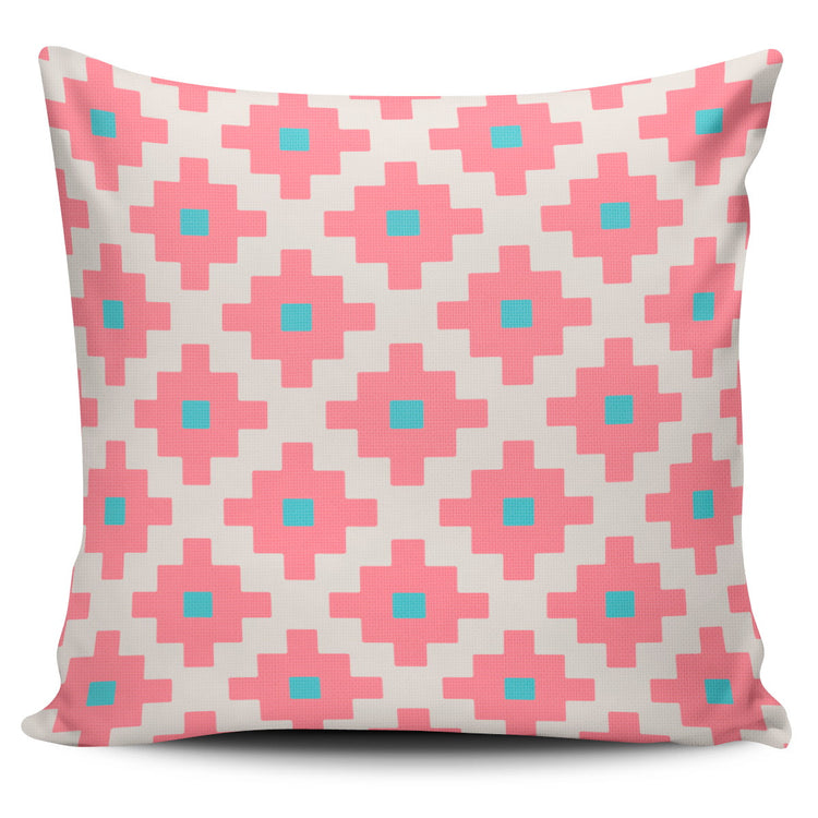 Cushion cover with pink, turquoise and cream stepped diamond shapes.
