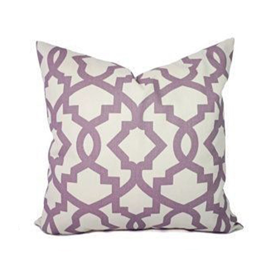 Cream cushion cover with an angular mauve lattice pattern.
