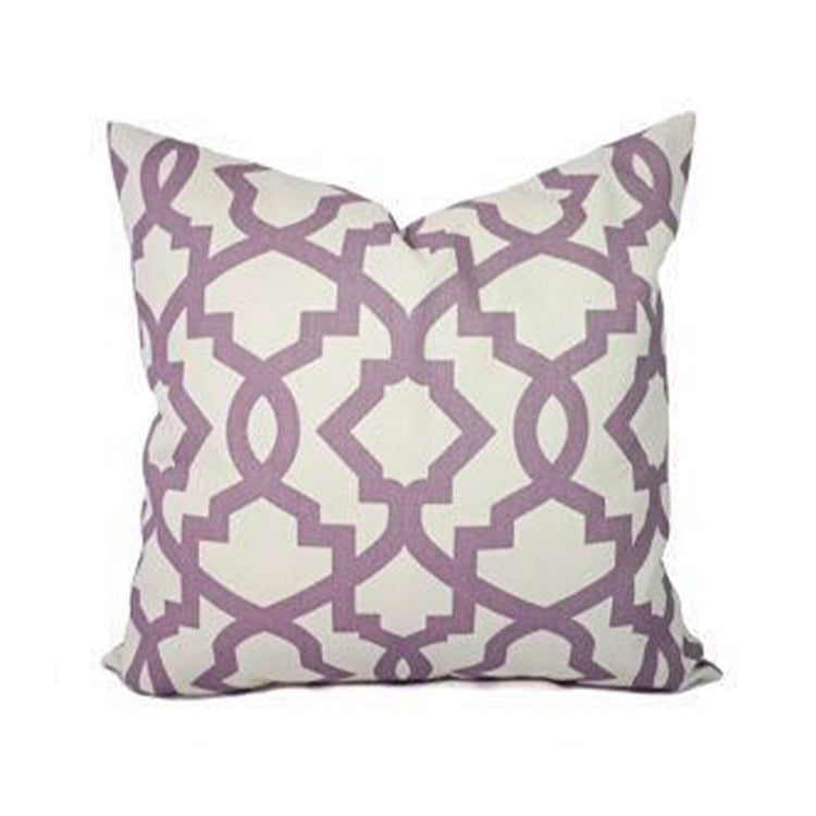 Cream cushion cover with an angular mauve lattice pattern.