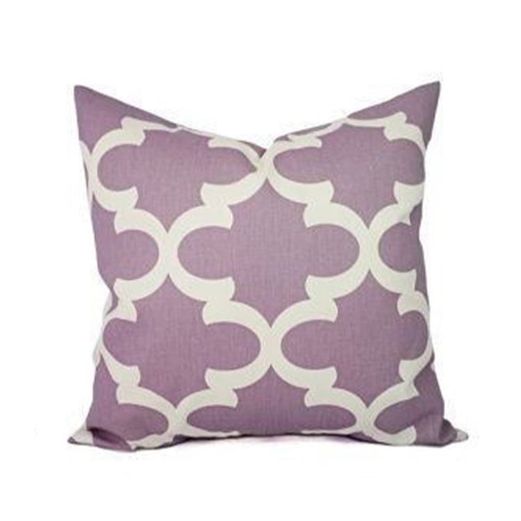 Mauve cushion cover with a cream interlocking circle pattern.