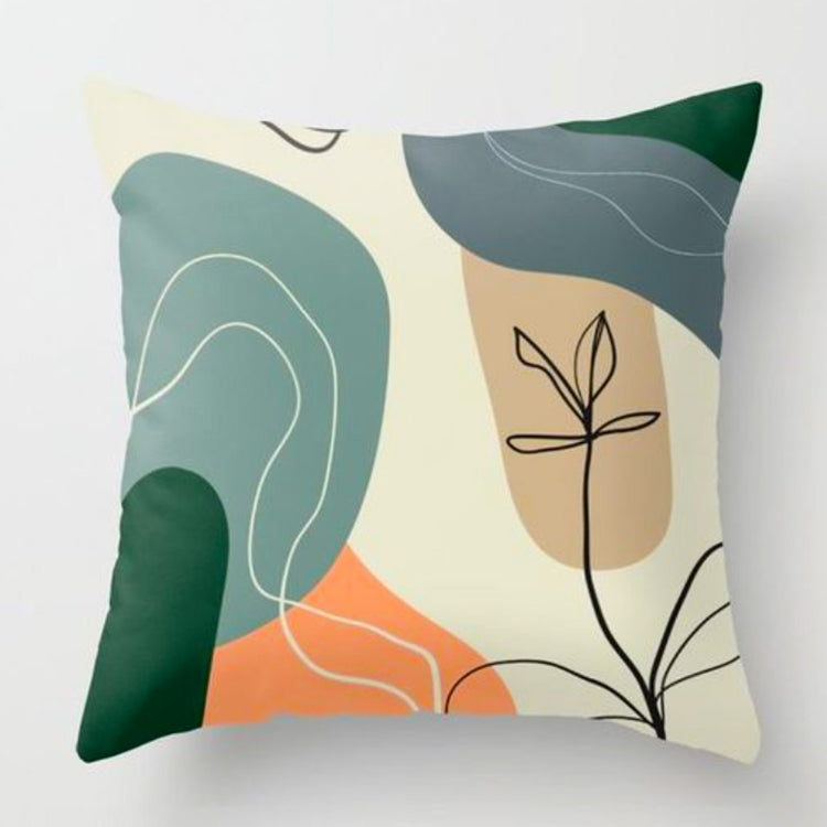 Cushion cover with black botanical outlines over green, cream and orange shapes.