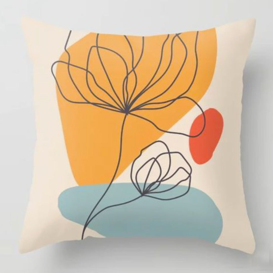 Cream cushion cover with fine flower outlines over mustard and pale blue shapes.