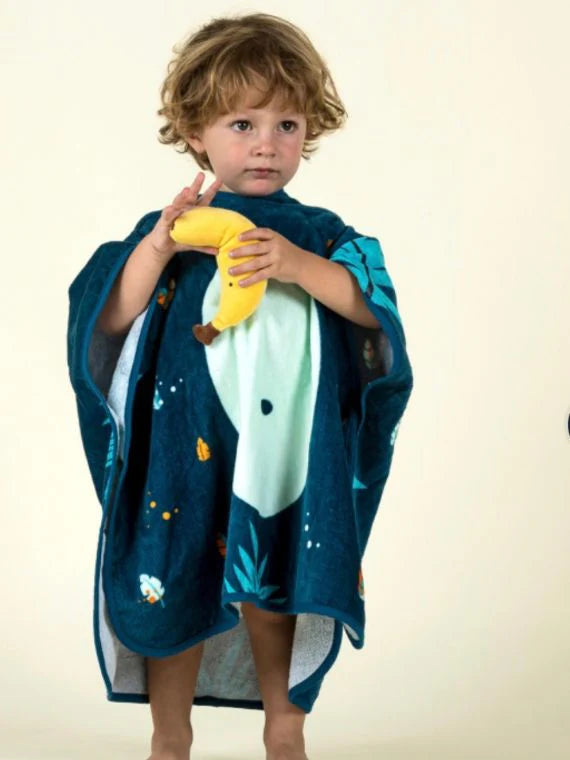 Child wearing a navy jungle-animal hooded towel poncho.