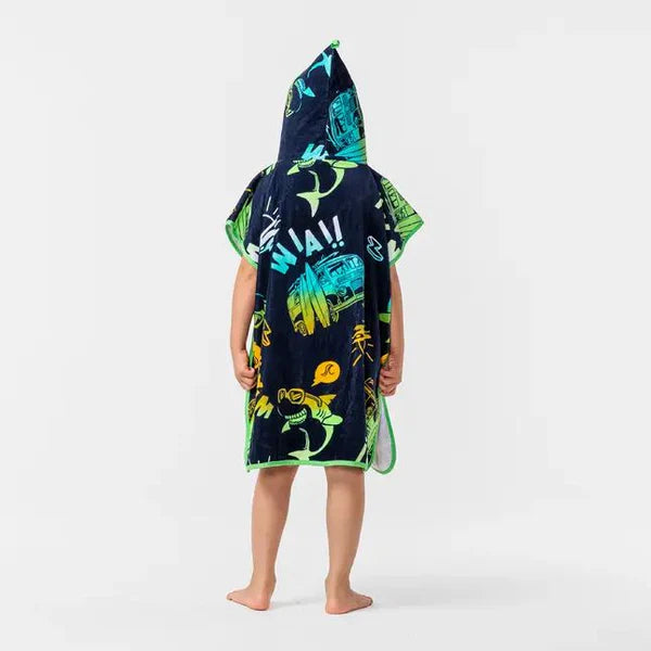 Back view of a dark sea-life-print hooded towel poncho worn by a child.